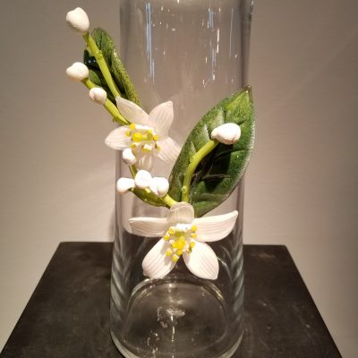 Blown glass vase with hot-sculpted flower