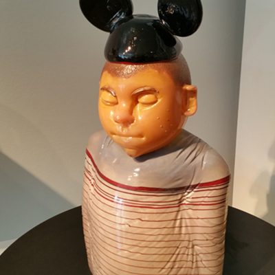 Sculpted glass boy with Mickey Mouse hat by Danny White